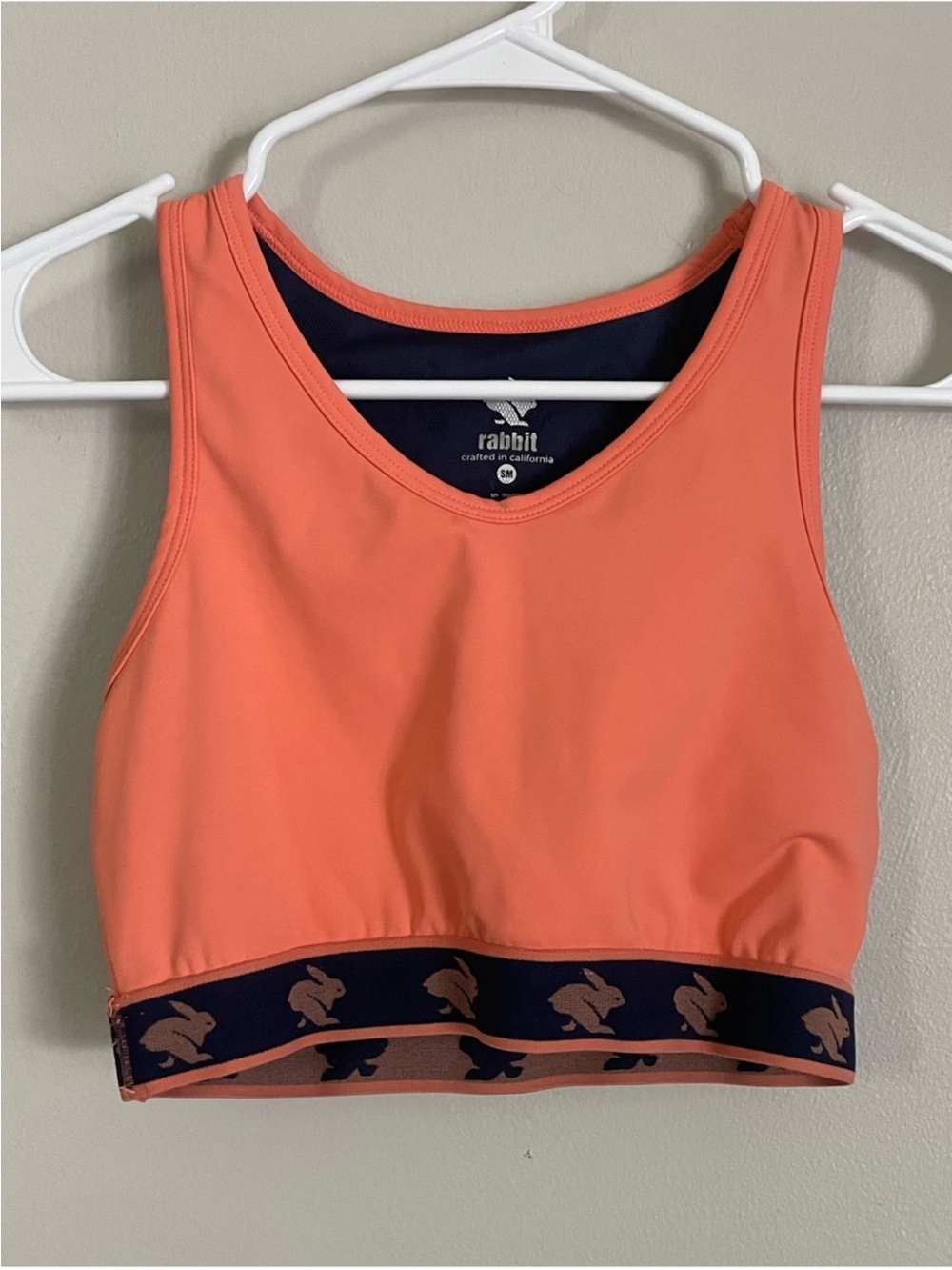 rabbit running sports bra in coral with navy band